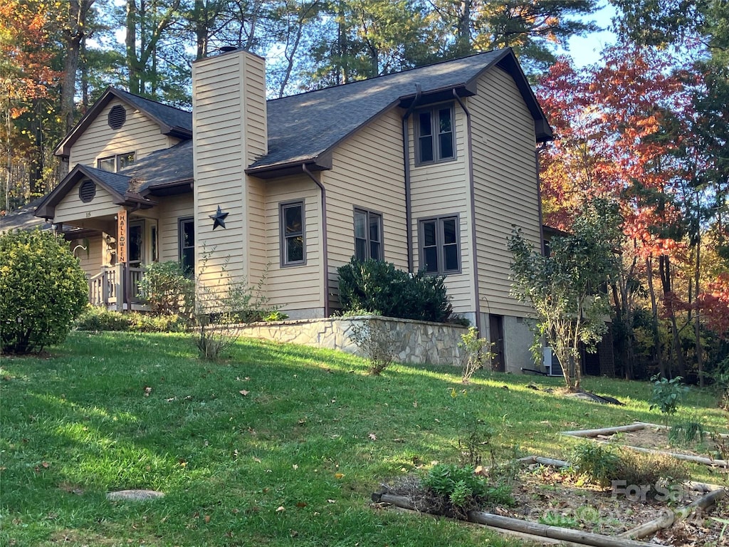 view of home's exterior featuring a yard