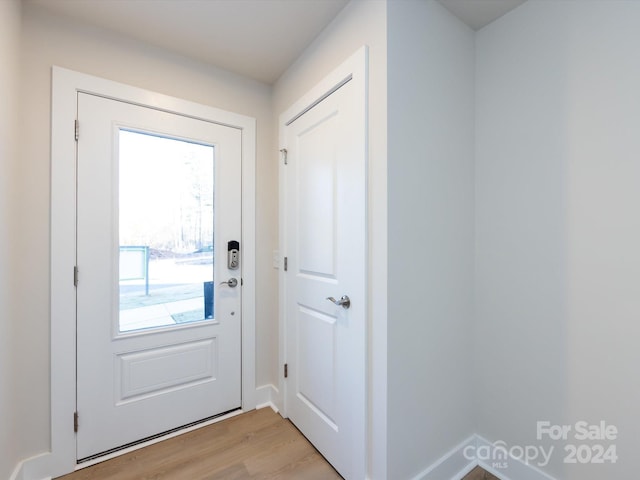 1530 Levy Way, Charlotte, NC 28205 - doorway featuring light wood-type flooring and baseboards