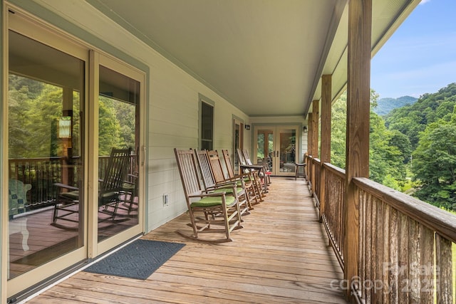 deck with a mountain view and french doors