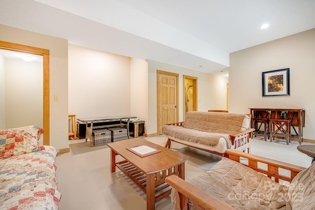 living room with recessed lighting and baseboards