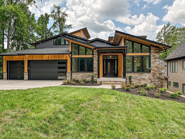 modern home with a garage and a front lawn