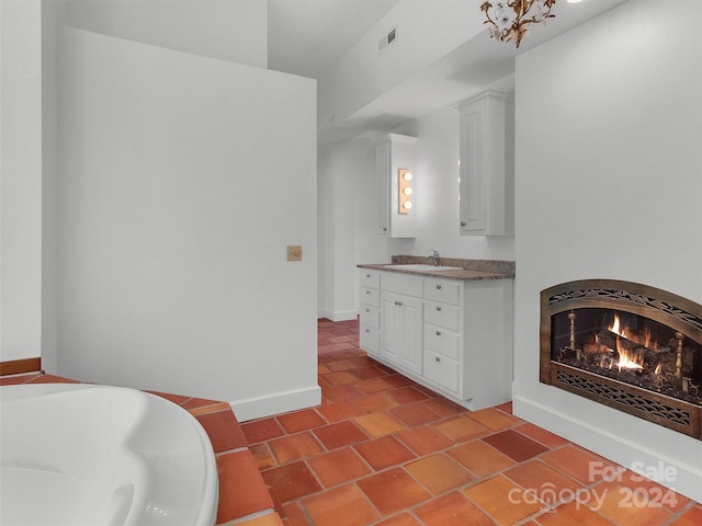 bathroom with vanity and a bathing tub