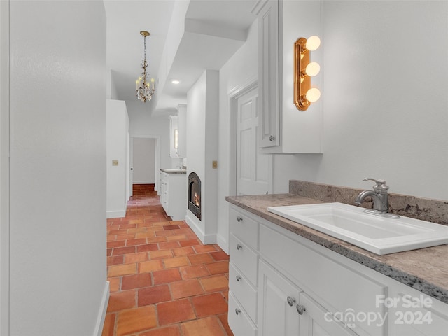 bathroom featuring vanity and a chandelier