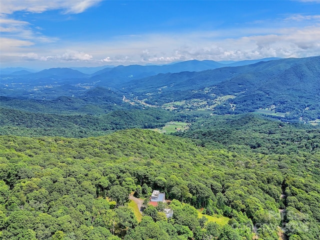 aerial view featuring a mountain view and a wooded view