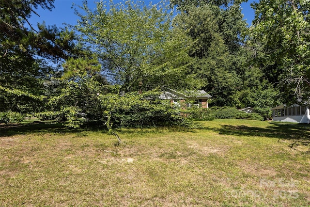 view of yard featuring a sunroom