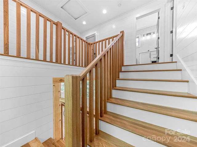 staircase with light wood-type flooring