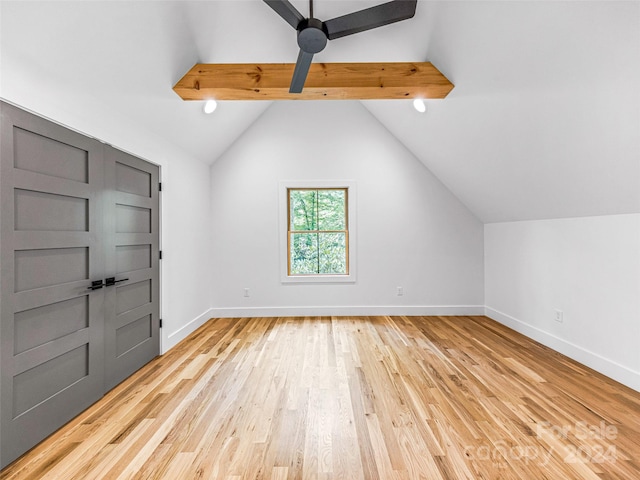 interior space with lofted ceiling with beams, light wood-type flooring, and ceiling fan