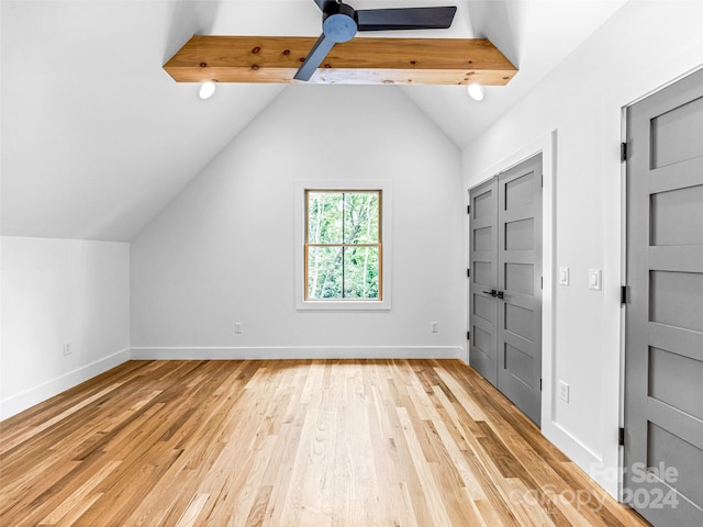 bonus room with vaulted ceiling and light wood-type flooring