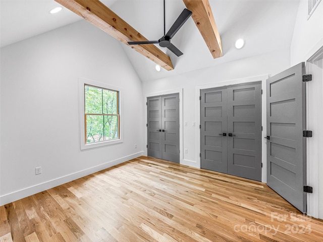 entryway with high vaulted ceiling, beamed ceiling, light wood-type flooring, and ceiling fan