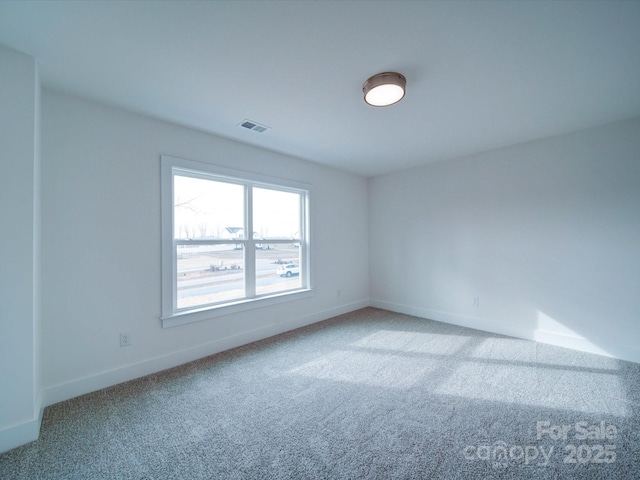 unfurnished room featuring carpet flooring