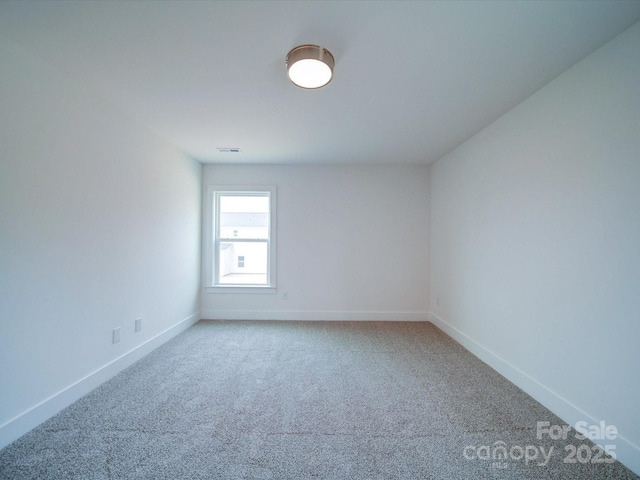 empty room featuring carpet flooring