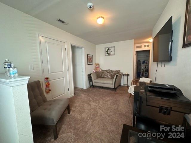 living room featuring carpet floors