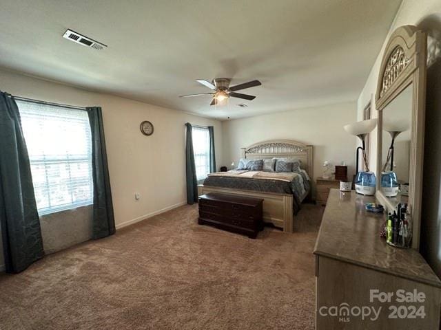 carpeted bedroom featuring ceiling fan