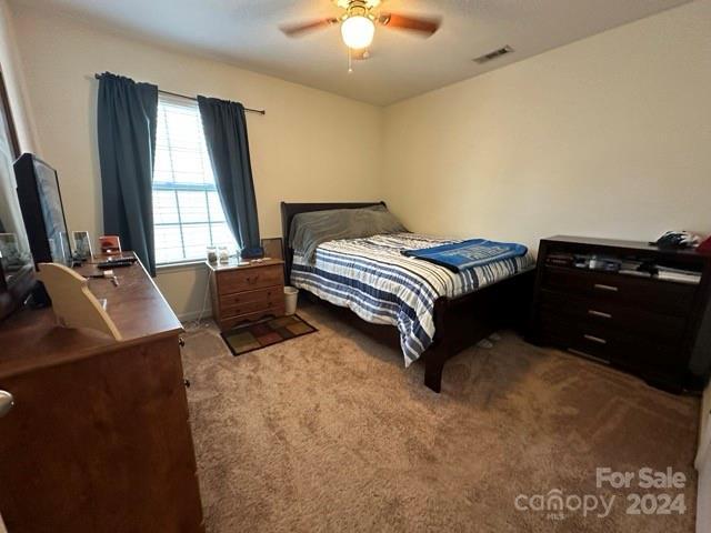 bedroom featuring carpet flooring and ceiling fan