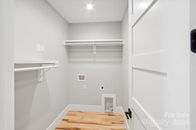 laundry area featuring hardwood / wood-style flooring, hookup for a washing machine, and hookup for an electric dryer