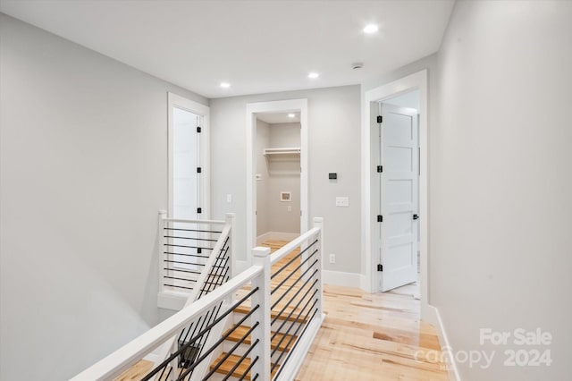 corridor featuring light hardwood / wood-style floors