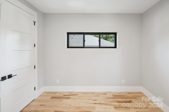 unfurnished room featuring light hardwood / wood-style flooring