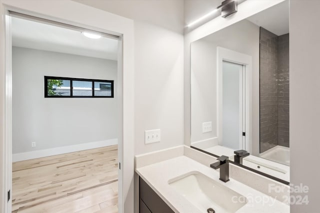 bathroom featuring hardwood / wood-style floors and vanity