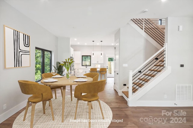 dining area featuring hardwood / wood-style floors