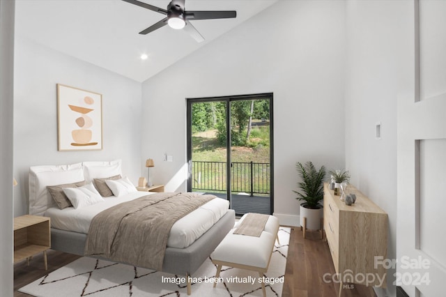 bedroom with ceiling fan, access to exterior, high vaulted ceiling, and dark wood-type flooring