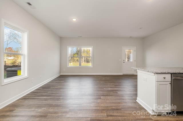 unfurnished living room featuring dark wood-type flooring