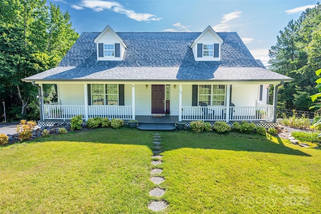 view of front of property with a porch and a front yard