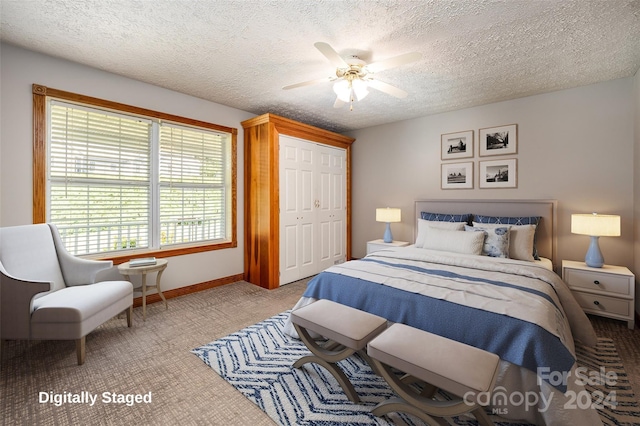 bedroom featuring a closet, ceiling fan, and a textured ceiling