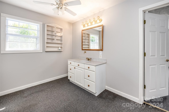 bathroom with ceiling fan and vanity