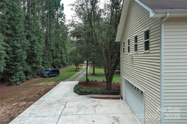 view of yard featuring a garage