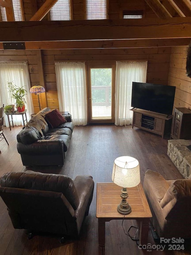 living room with wood walls and hardwood / wood-style flooring