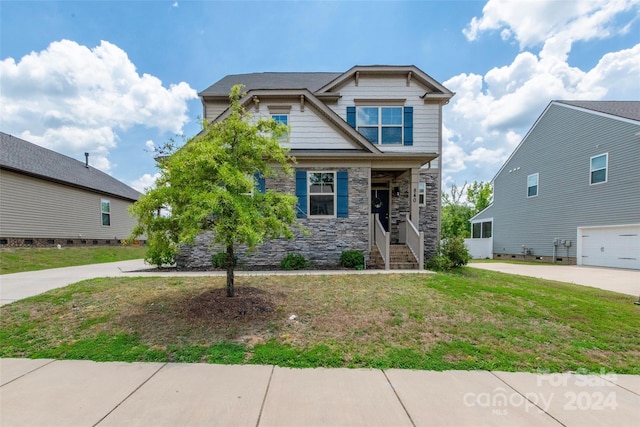 craftsman-style home with a front lawn