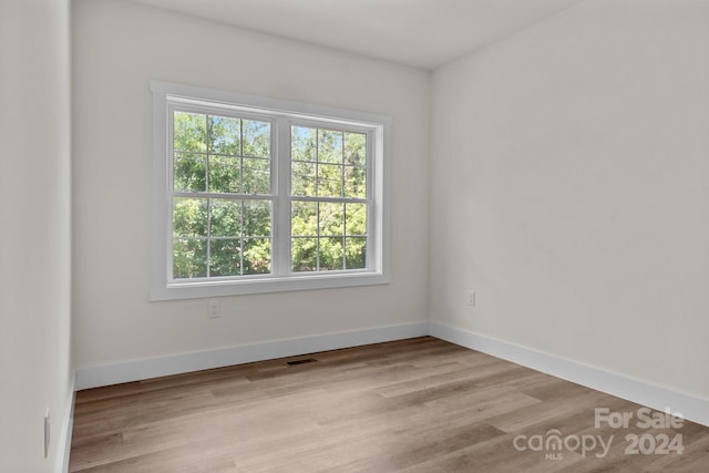 empty room with light hardwood / wood-style floors