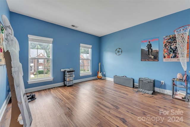 miscellaneous room with hardwood / wood-style flooring