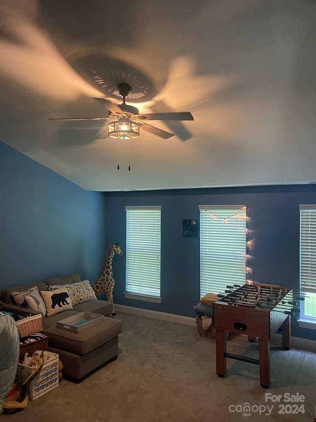 carpeted living room featuring ceiling fan