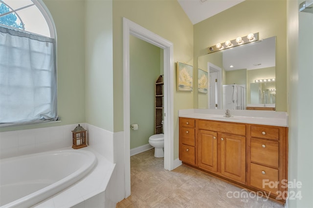 full bathroom with plus walk in shower, vanity, lofted ceiling, and toilet