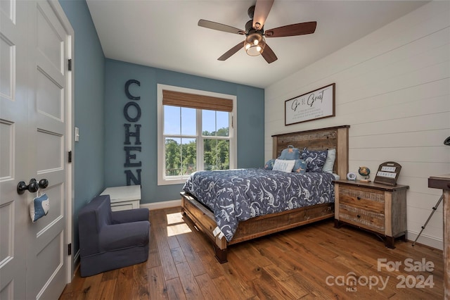 bedroom featuring ceiling fan and dark hardwood / wood-style flooring