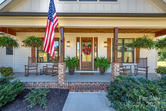 view of exterior entry with covered porch