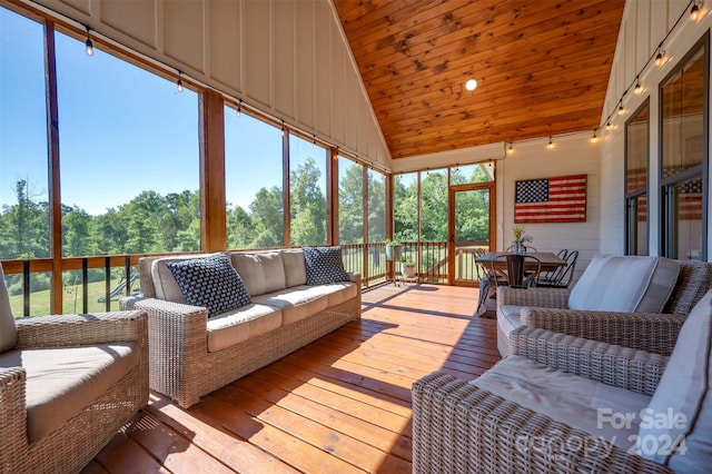 sunroom with wooden ceiling and lofted ceiling