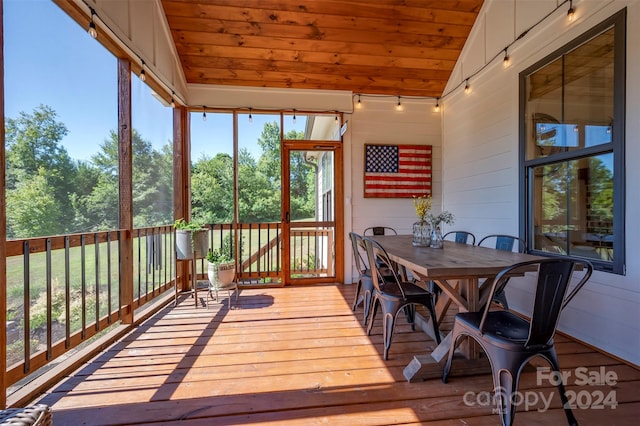 sunroom featuring wooden ceiling and vaulted ceiling