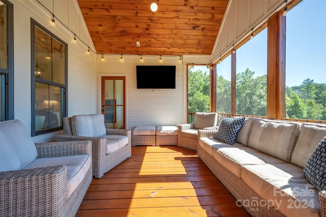 sunroom / solarium with lofted ceiling and wood ceiling