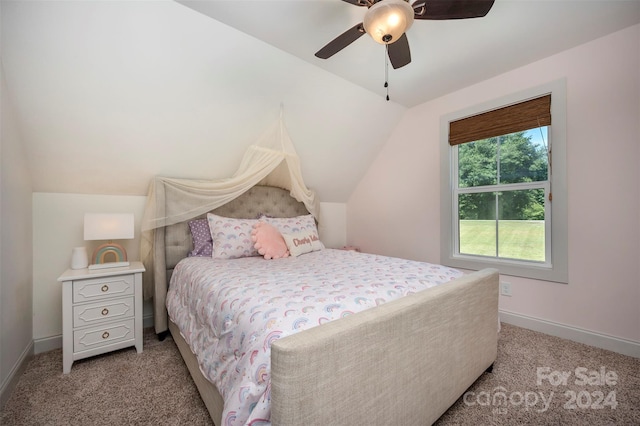 bedroom with ceiling fan, lofted ceiling, and light colored carpet