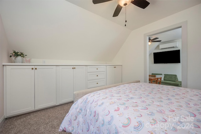 carpeted bedroom with ceiling fan, a wall mounted AC, and vaulted ceiling