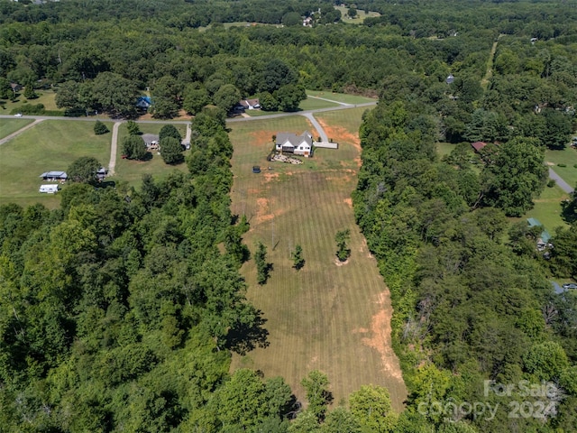 birds eye view of property featuring a rural view