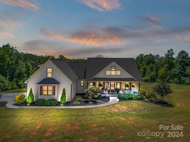 modern farmhouse featuring a yard and a porch