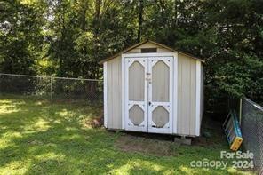 view of outdoor structure with a lawn