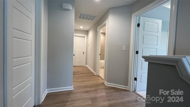 corridor featuring hardwood / wood-style flooring