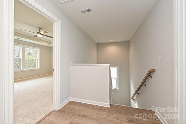 foyer featuring ceiling fan and light hardwood / wood-style flooring