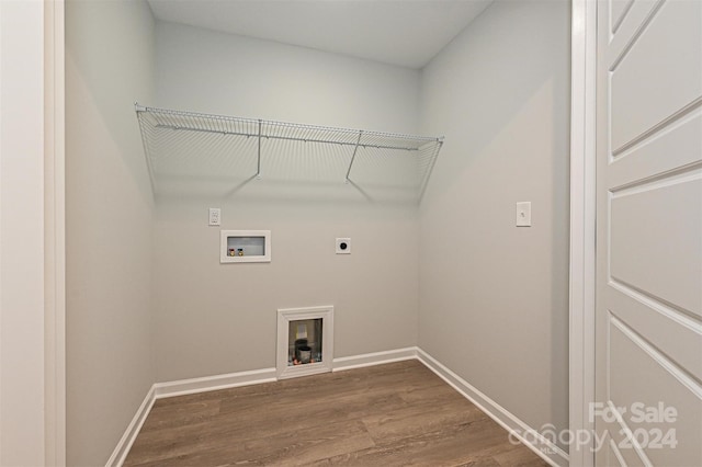 washroom with hardwood / wood-style flooring, electric dryer hookup, and washer hookup