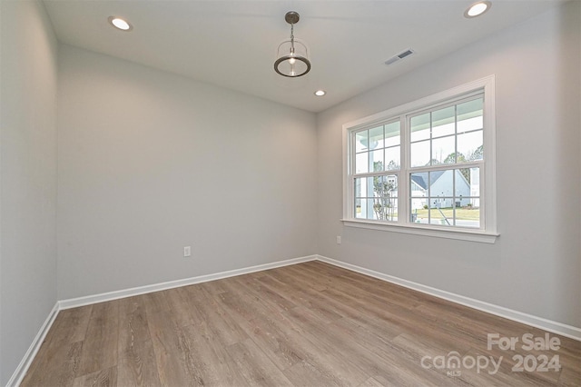 spare room featuring light wood-type flooring