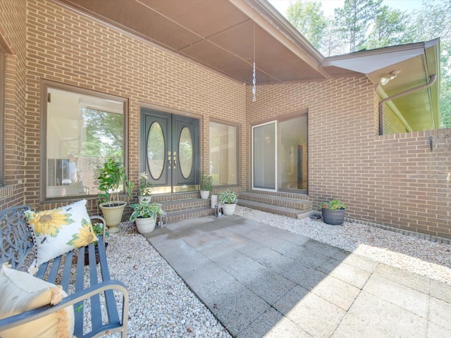 entrance to property with a patio and french doors